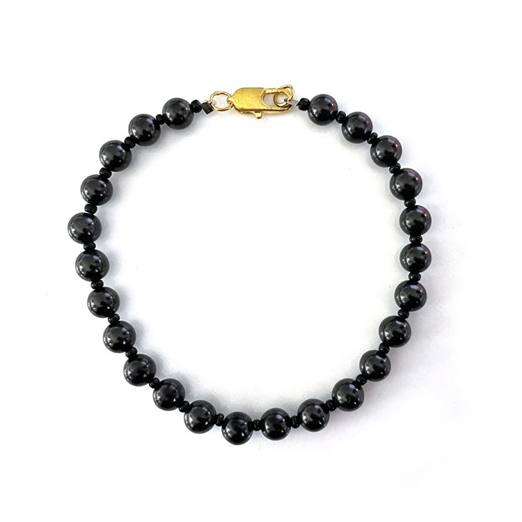 BRACCIALE DI SHUNGITE - PERLE TONDE E CILINDRI IN MARMO NERO Cristalli e altro Cristalli e altro